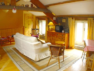 The Hayloft open plan living room with lofted ceiling